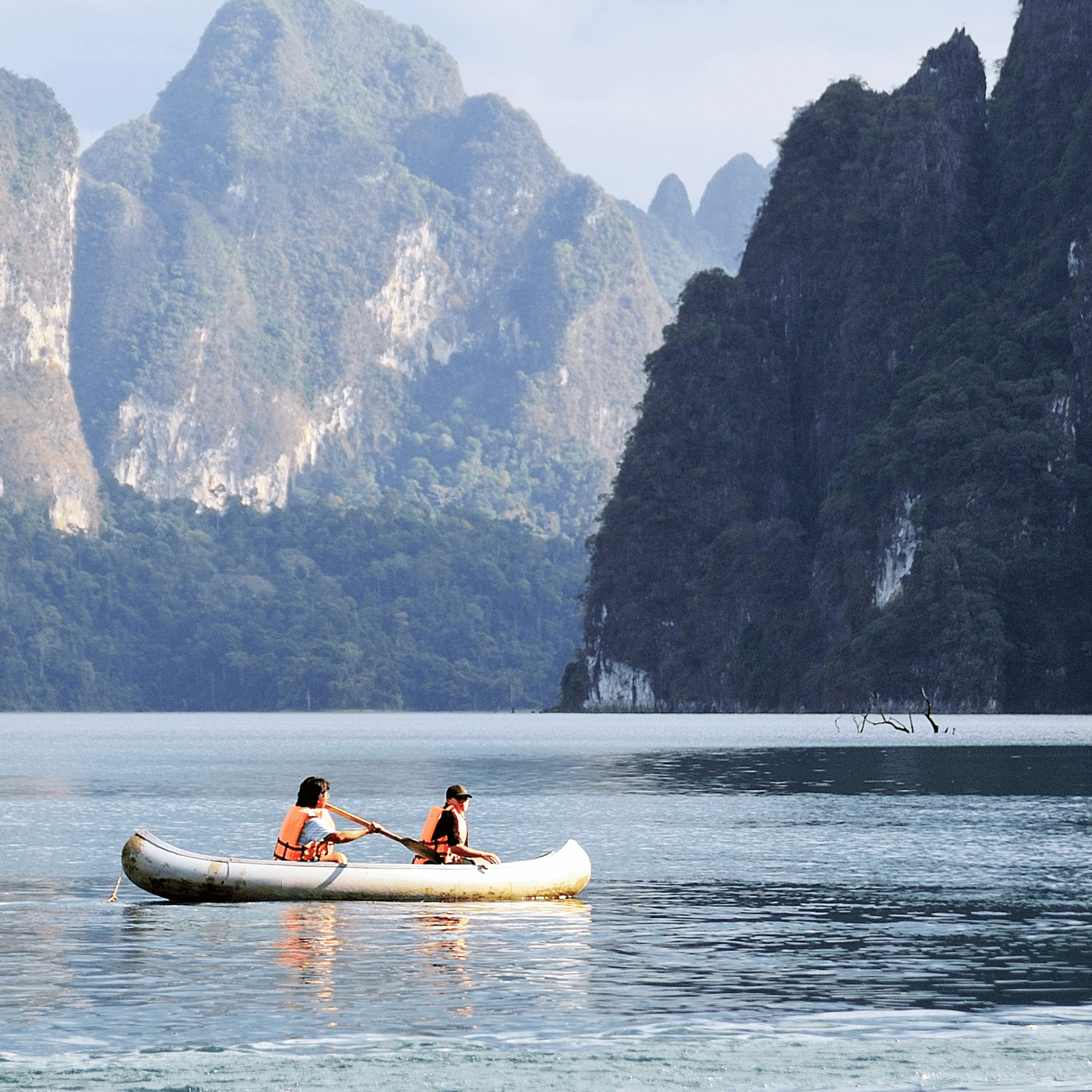 Two people canoeing on a lake